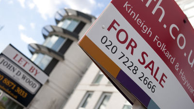 A close up image of a 'for sale' sign